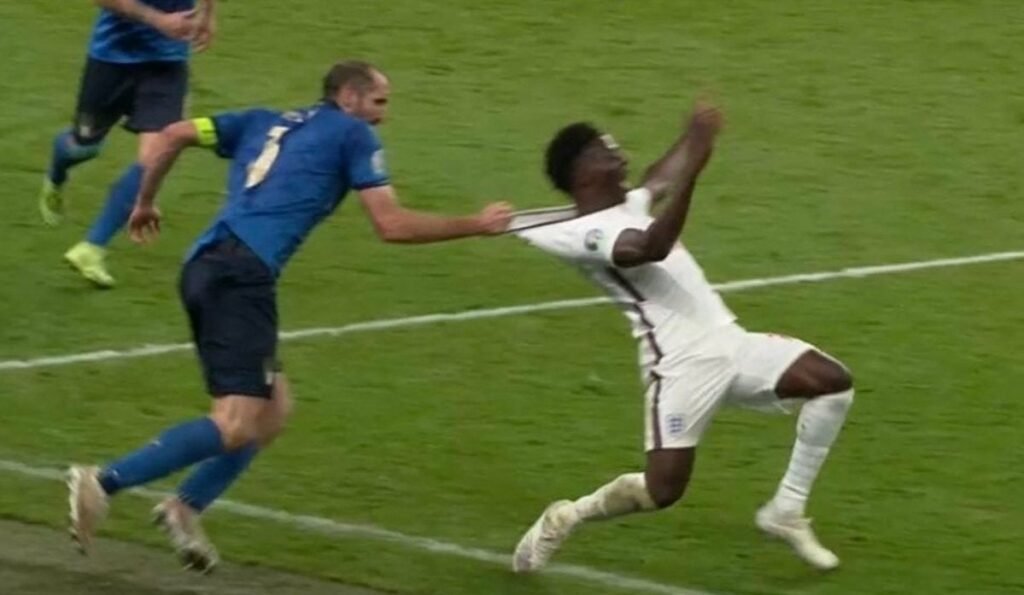 Footballer Pulling Another Footballer